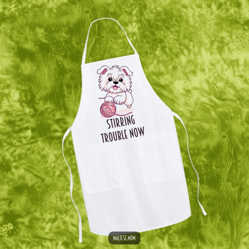 Funny Maltese dog apron featuring a cute character hilariously chasing a rolling ball of yarn, perfect for kitchen fun and protecting apparel.