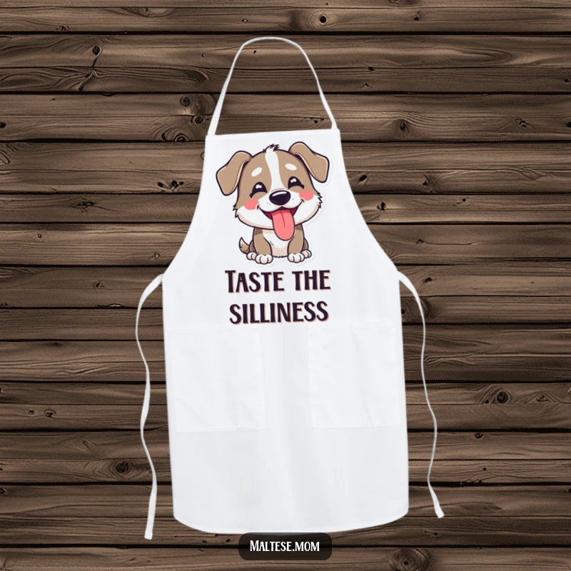 Funny apron showing a dog character with a happy, goofy expression and its tongue playfully peeking out, for kitchen fun.