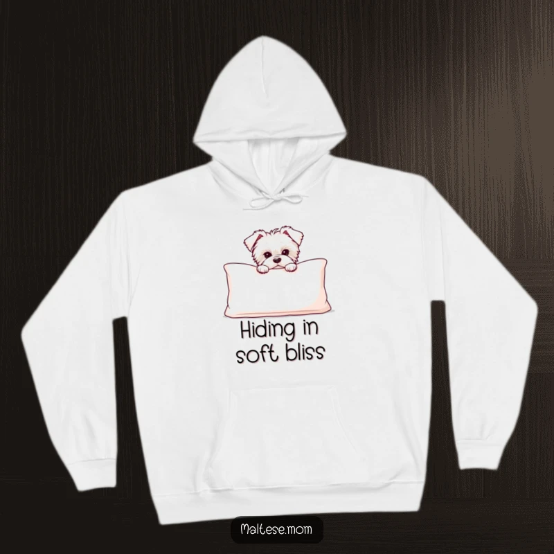 Funny Maltese puppy peeking out from behind a big, soft cushion, printed on a warm and cozy hoodie.