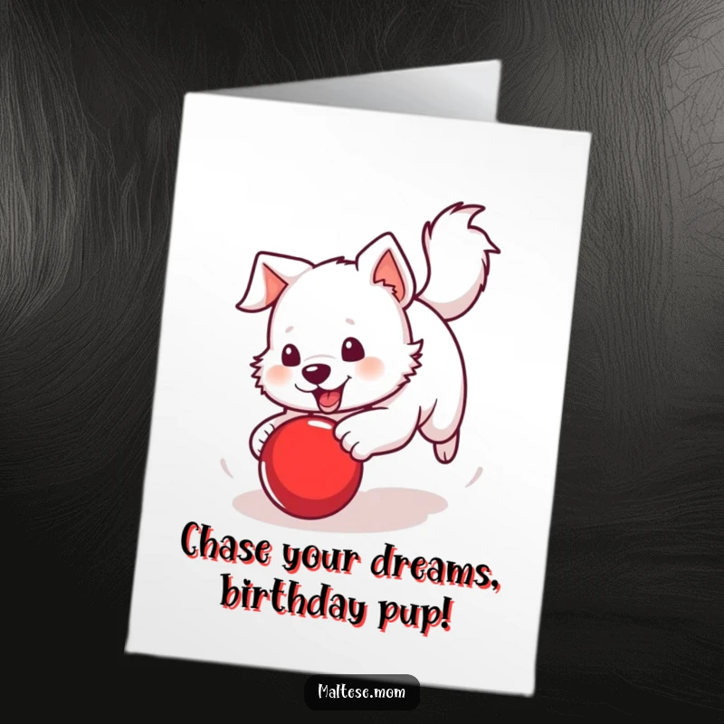 Funny Free Printable Birthday Card: White dog with a perky tail excitedly chasing a bright red ball.