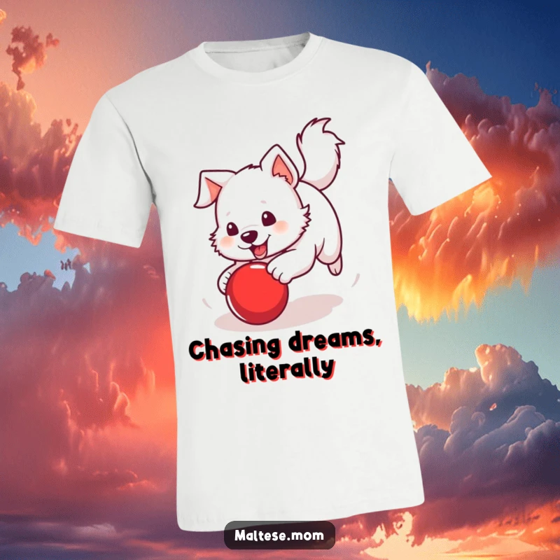 Funny T-Shirt of a white dog with a perky tail in pursuit of a bright red ball, capturing athletic fun.