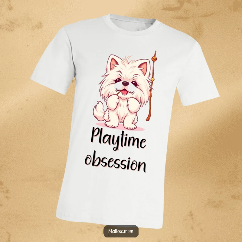 Funny Maltese lady dog t-shirt, batting playfully at a string, energetic and focused.